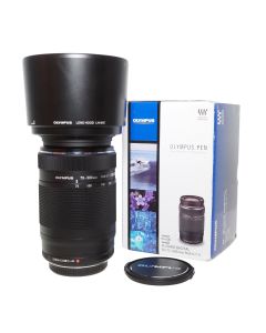 Brugt Olympus OM-System M.Zuiko 75-300mm f/4.8-6.7 II ED MSC set stående med modlysblænde og kasse